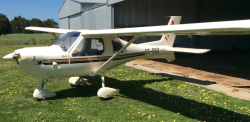 The Jabiru aircraft in front of a small hanger