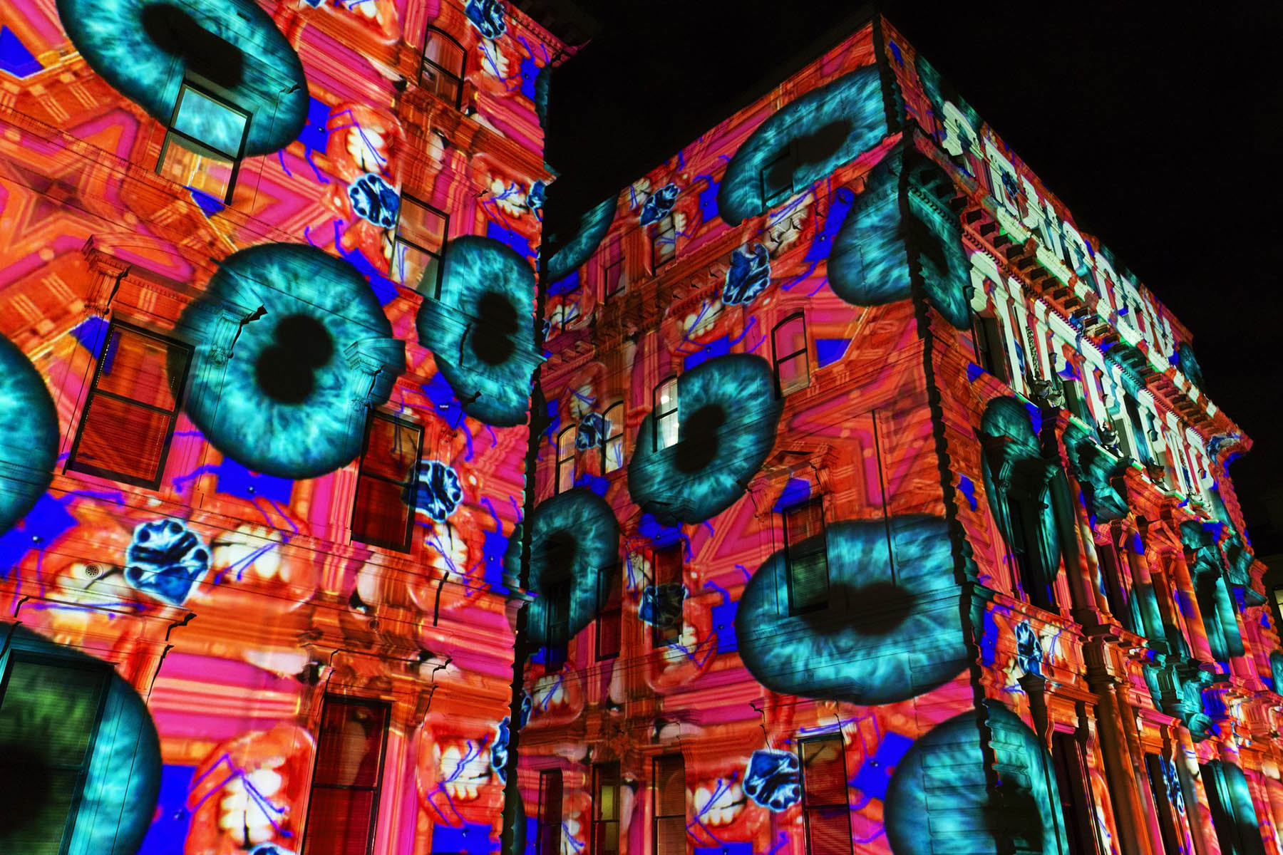 An art installation projected onto building facades in Melbourne.