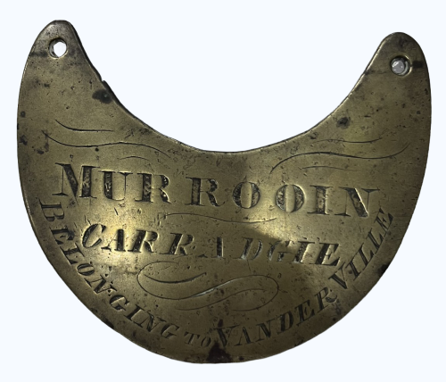 A brass breastplate engraved with ‘Murrooin Carradgie’. 