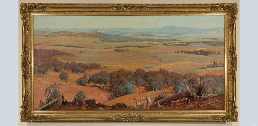  A landscape painting of early Canberra, hanging on a wall in a gold frame.