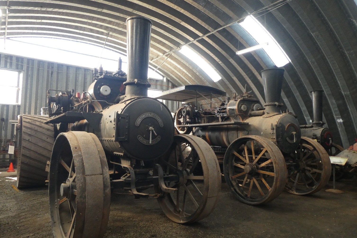 The 100-year-old steam engines in a warehouse. 