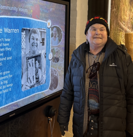 Aunty Lyn Warren interacting with one of the touch panels to read the story she shared. Photo by Liz Thompson.