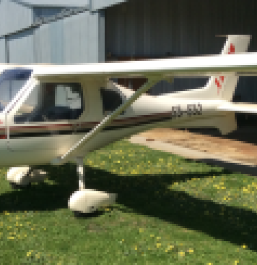 The Jabiru aircraft in front of a small hanger