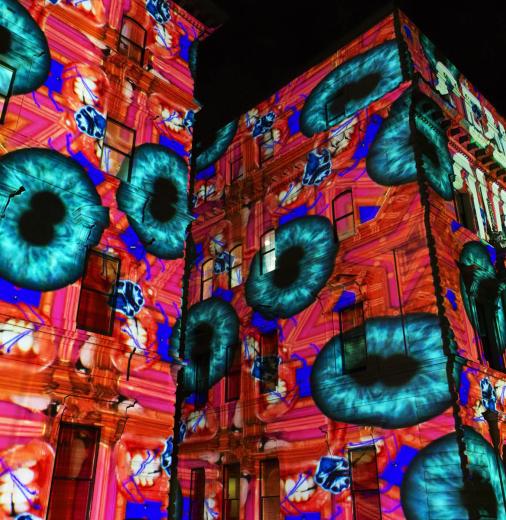 An art installation projected onto building facades in Melbourne.