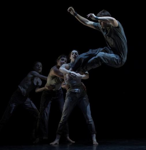 The Circa ensemble performs acrobatics on stage.