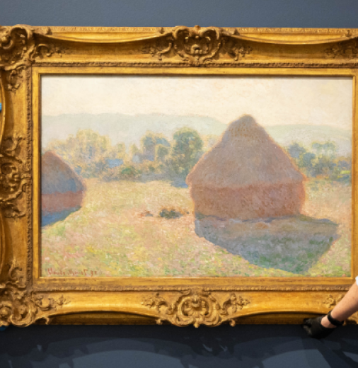 Art technician Chas Glover and Tweed Regional Gallery Curator - Exhibitions Tina Wilson hanging Claude Monet's masterpiece 'Meules, milieu du jour [Haystacks, midday]', 1890, as part of the National Gallery of Australia's Sharing the National Collection initiative. Photo by Luke Marsden.