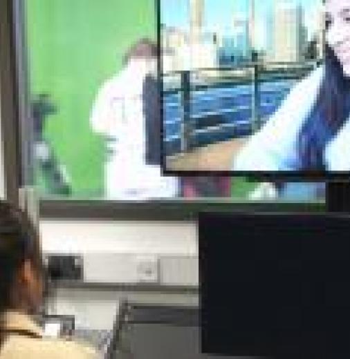 Screen workers editing green screen vision in a control room 