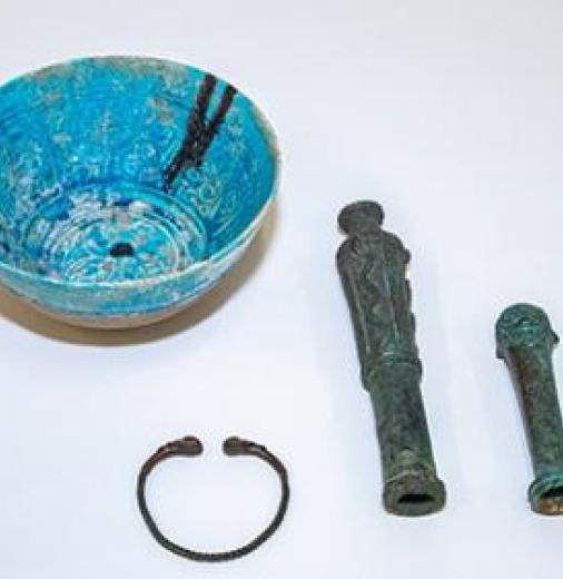 Bronze bracelet and two decorative finials from Luristan, and an Islamic pottery bowl