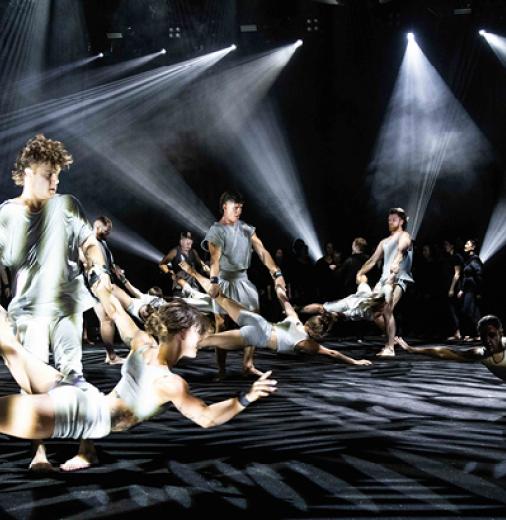 Dancers spin each other on stage