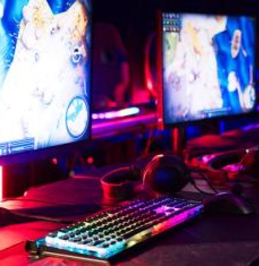 Multiple brightly coloured PC screens to be used by professional gamers