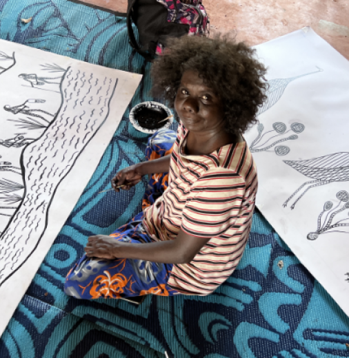 Jay Jurrupula Rostron with two new 2022-2023 screen print designs ‘Galk and Namurre Boko’ during workshop with Bobbie Ruben in 2022 (Bawinanga Aboriginal Corporation).