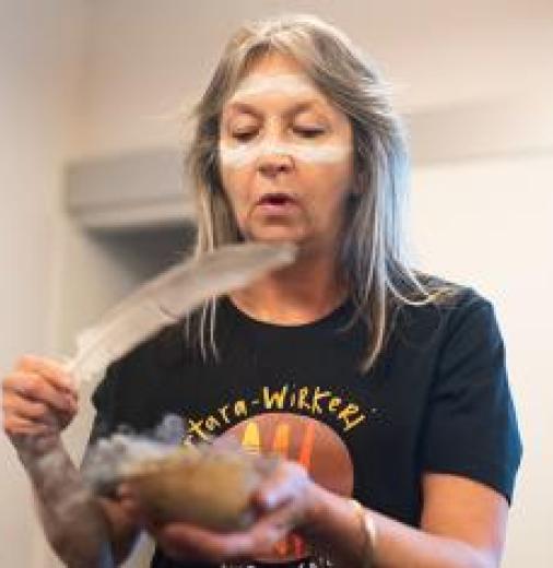 Robyn Campbell of South East First Nations of South Australia performing smoking ceremony at Oxford Museum of Natural History