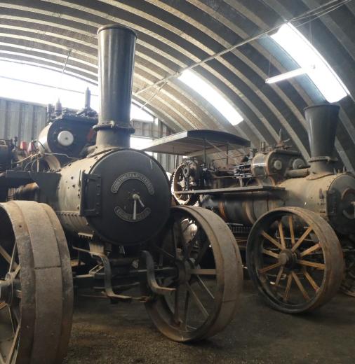 The 100-year-old steam engines in a warehouse. 