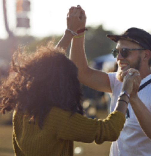 Couple Dancing At Music Festival