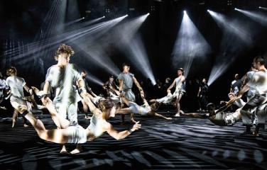 Dancers spin each other on stage