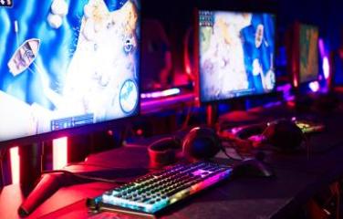 Multiple brightly coloured PC screens to be used by professional gamers