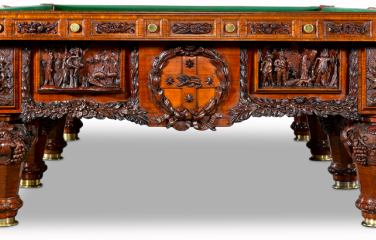 The History of Australia Billiard Table, with green felt top and ornate carvings on timber side and end panels